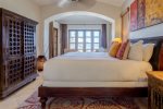 Tastefully decorated master bedroom with satellite TV, high thread count linens